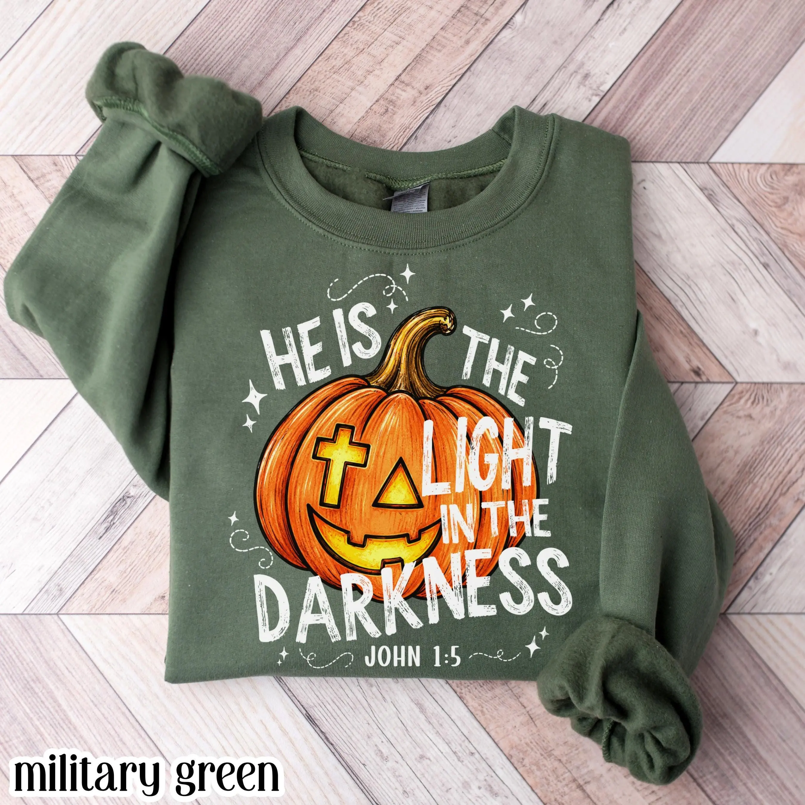 He Is The Light In The Darkness Christian Halloween Sweatshirt, John 1:5 Faith Pumpkin Fall Bible Verse Crewneck - photo 3